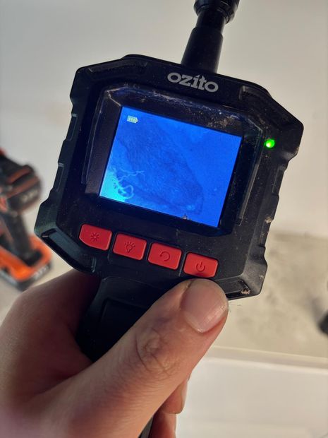 Inspection camera used to confirm the source inside the wall cavity