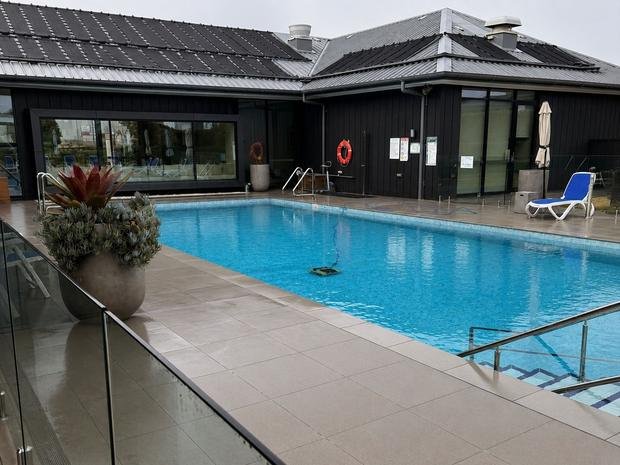 Outdoor pool area serviced under a commercial program