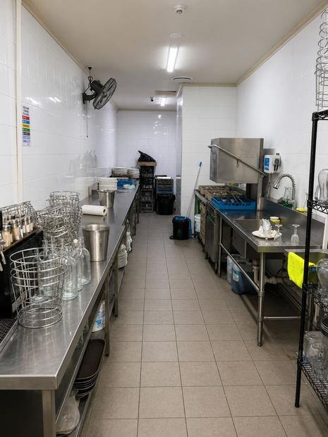 Commercial kitchen and wash-up area treated to food-safety standards