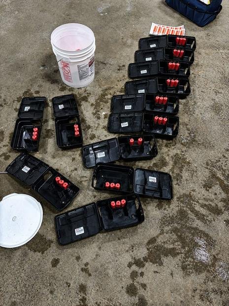 Tamper-resistant bait stations prepared for a rodent program