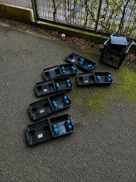 Bait stations positioned around a hard-surface perimeter