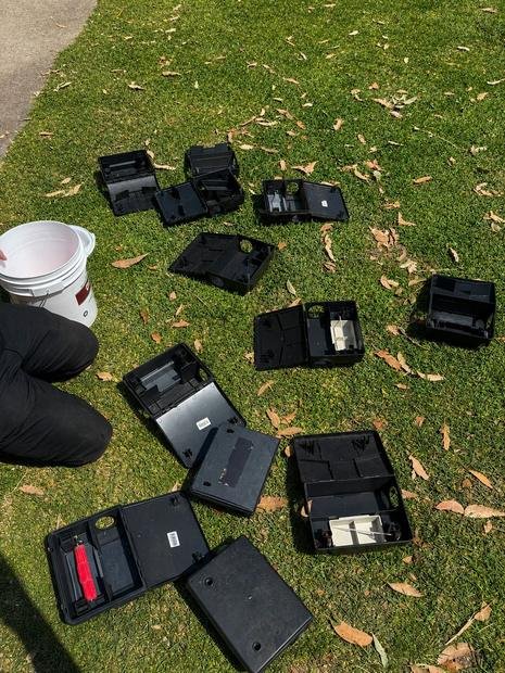 Technician servicing bait stations on a scheduled visit